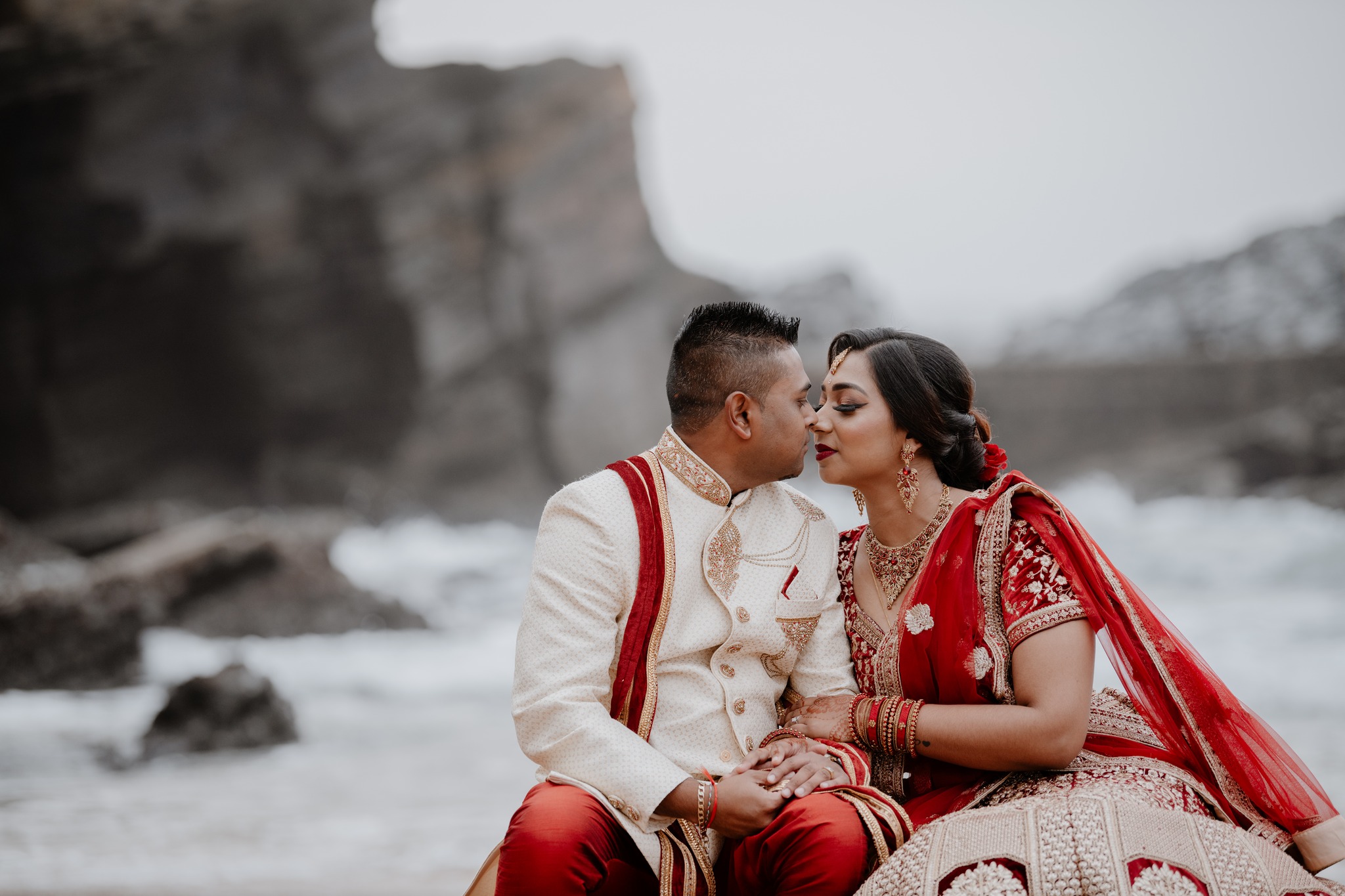  man and wife embracing on beach 