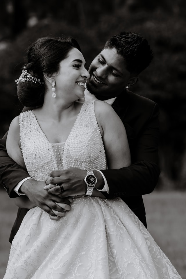  man hugging wife from behind 