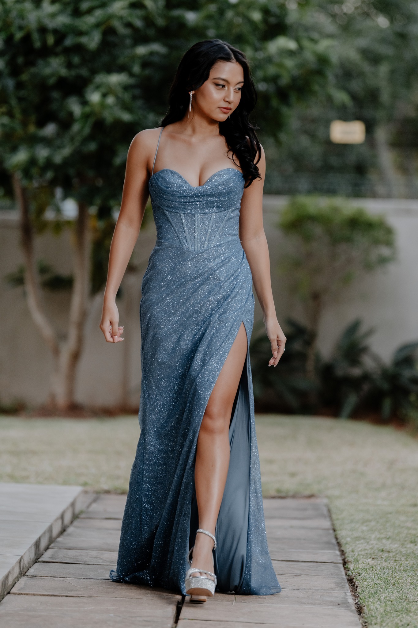  woman walking in dress 