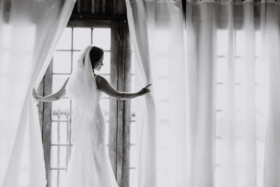  photo of bride at glass door 